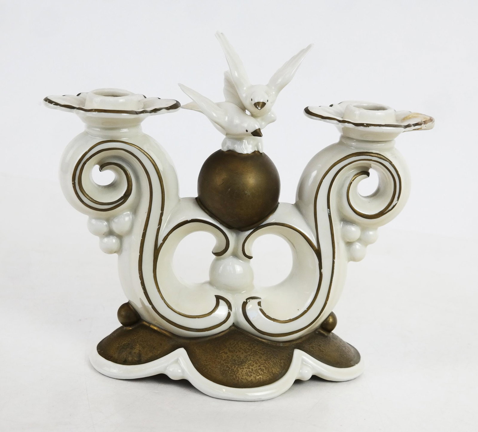 A Gerold Porzellan Company Candle Holder: Gerold Porzellan Company small candle holder, marked "N.P.T. Neutettan", incised "5474", in the Art Deco style. [7 1.2" H x 8" W x 4" D]. Repair to one candle holder lip, small chip to one bird's wing