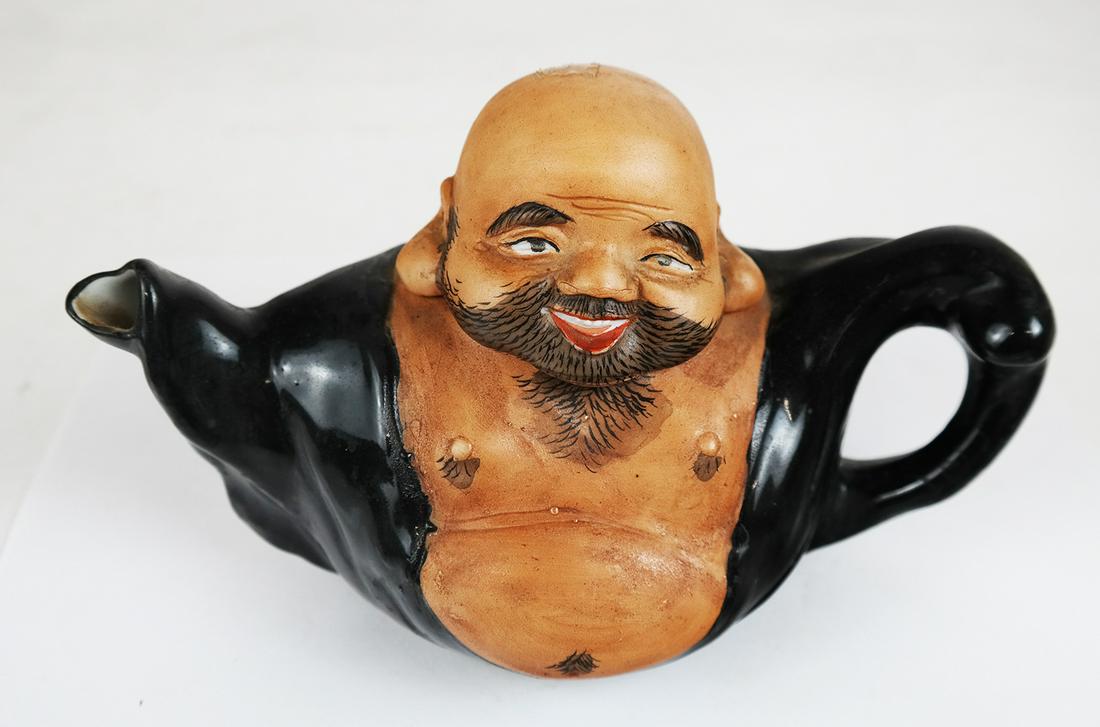 Japanese Novelty Teapot: Hand-painted teapot of unusual form, modeled as a torso of a Sumo wrestler. [4 1/2" H x 4 1/4" W x 8" D]. In good condition.