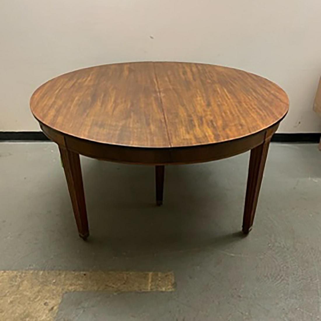 American Mahogany Dining Room Table: American mahogany dining table with 3 leaves, on reed-form legs. [30" H x 60" W x 60" D; 25 3/4" H to apron; Leaves: 12" W x 3].