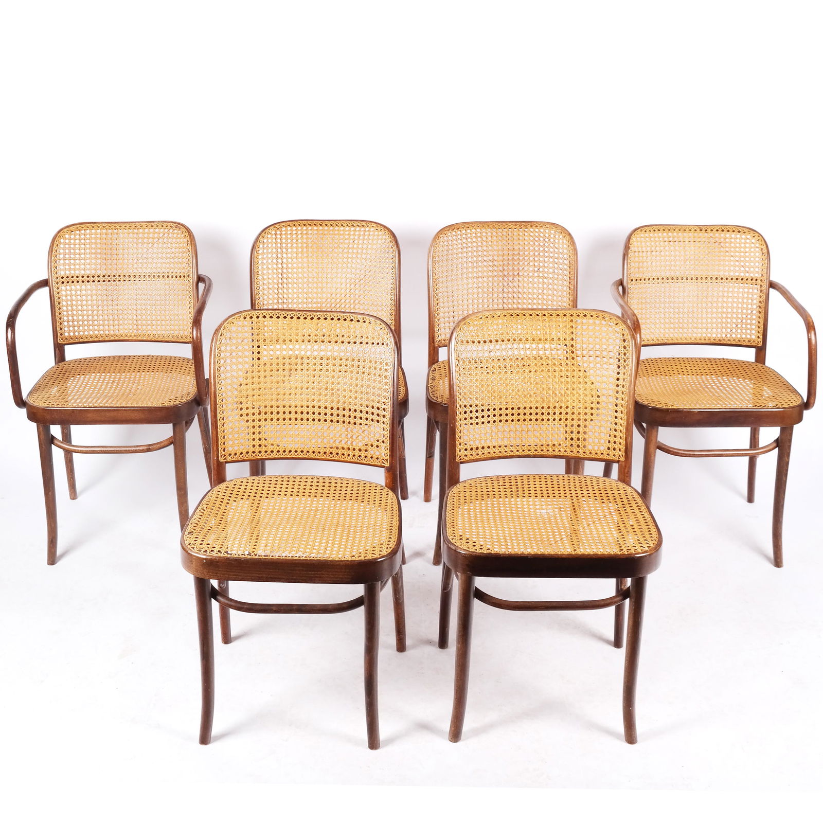 Six Josef Hoffman Caned Bentwood Chairs: Six Josef Hoffman (Czech, 1870-1956) caned bentwood chairs, after a design by Michael Thonet in the Bauhaus manner, comprising two armchairs and four side chairs. [Armchairs: 32" H x 20" W x 21" D; Si