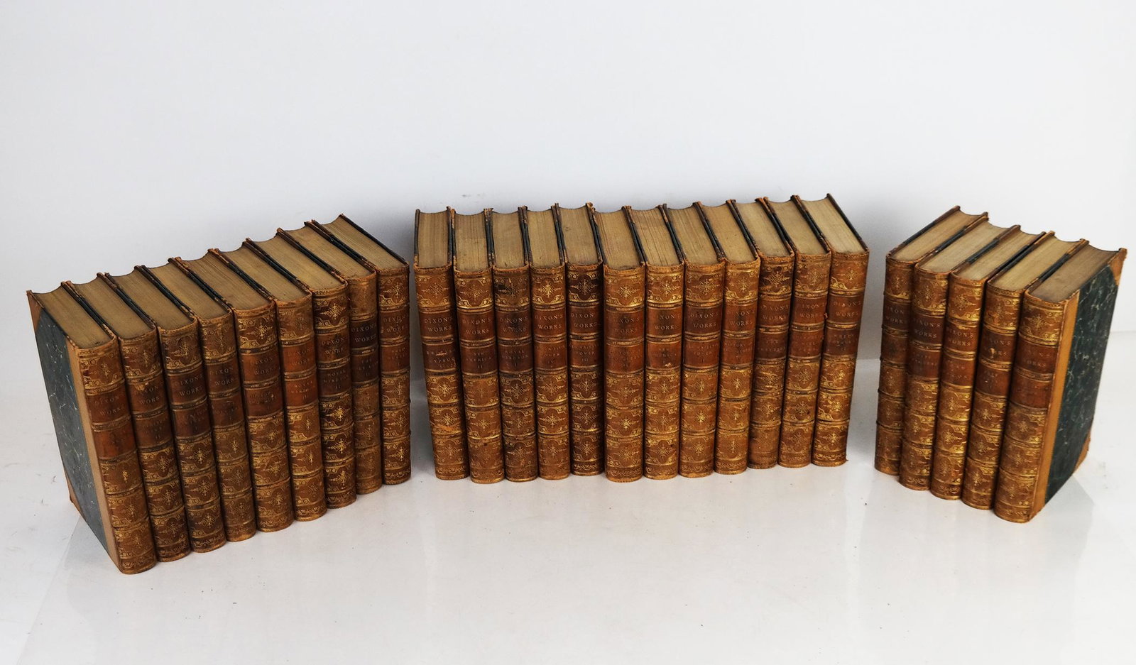 Dixon's Works - 26 Volumes, Circa 1870: William Hepworth Dixon's works, comprising various titles, in 26 volumes (possibly not complete) in three-quarter bindings with gilt lettering and marbled boards.