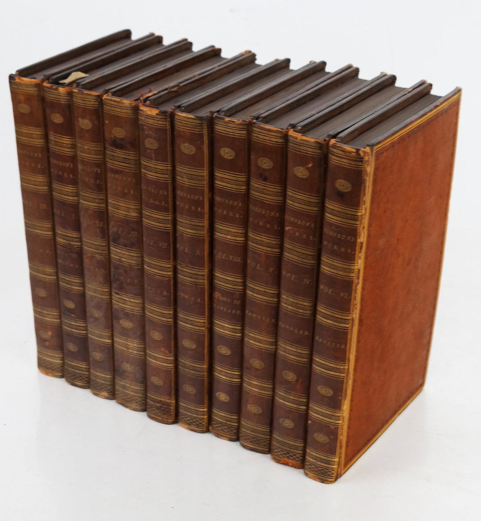 Johnson's Works - 10 Volumes, Circa 1805: Samuel Johnson (British, 1709-1784) works in 10 volumes (incomplete), in full leather bindings with gilt lettering. [9" H x 5 1/2" W].