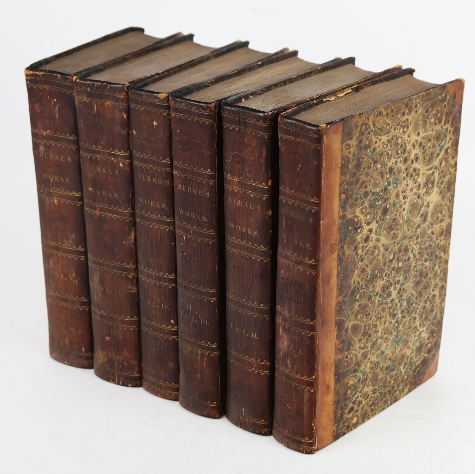 Burke's Works - 6 Volumes, Circa 1826: Works by the Rt. Hon. Edmund Burke, 6 volumes, in three-quarter leather bindings on marbled boards, with gilt lettering. [8 3/4" H x 5 5/8" W].