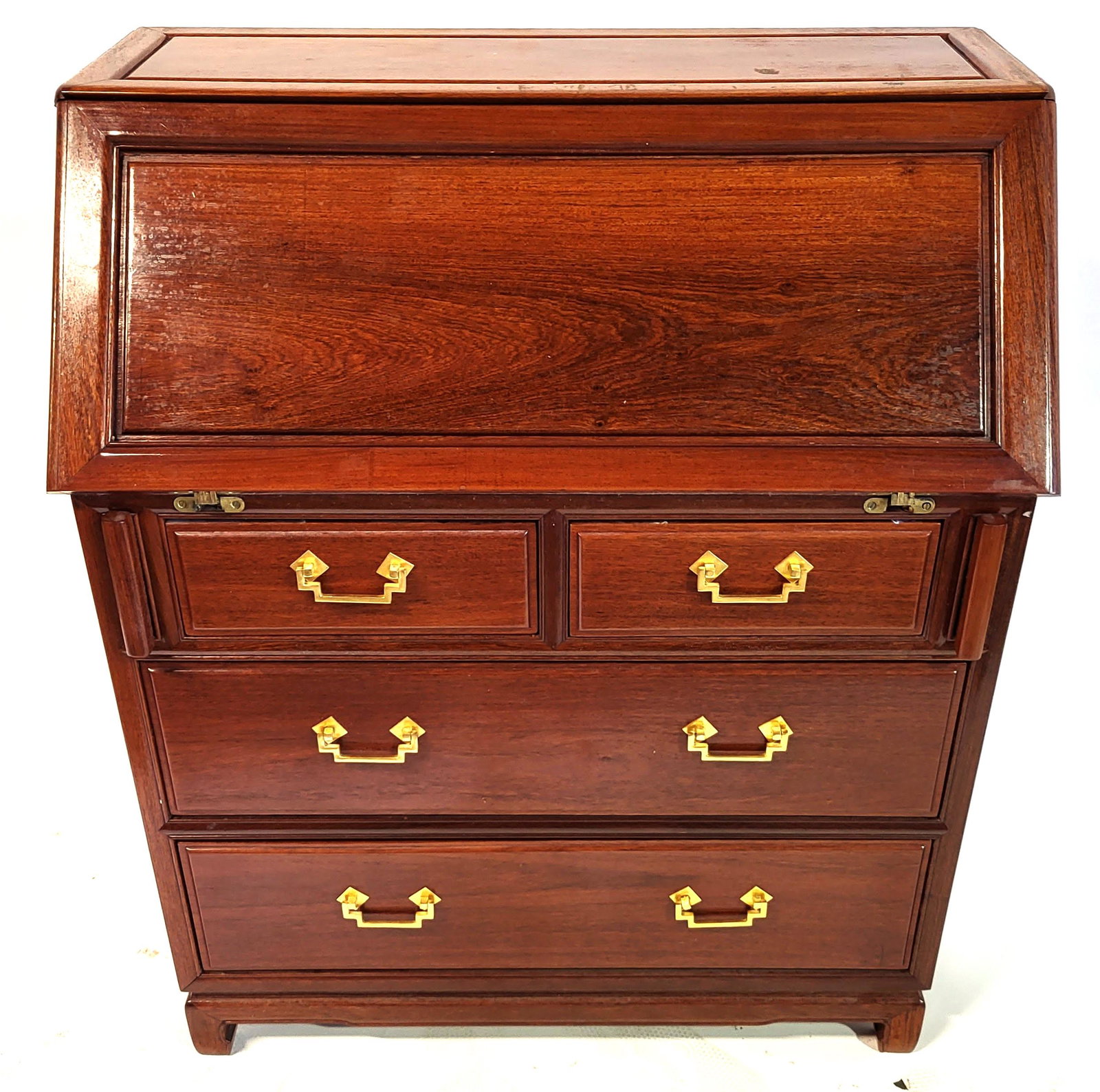 Chinese Fitted Slant Front Desk: Chinese slant front desk having bronze pulls, on mahogany finished case, with a fitted interior above 4 drawers. [42" H x 32" W x 18" D].