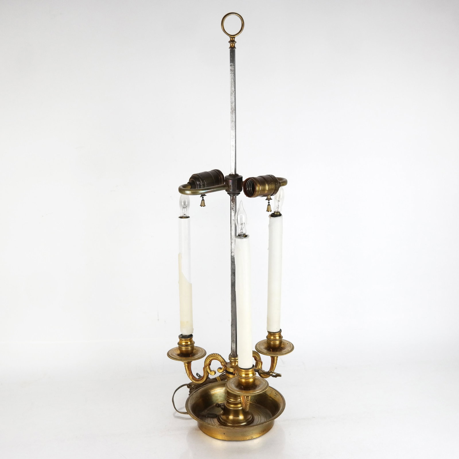 French Gilt Metal Bouillotte Lamp: French gilt metal bouillotte lamp. [27 1/2" H x 9 1/4" Diam.]. Lacking tole shade. Losses to wax candle covers, oxidation to metal, wires appear frayed.
