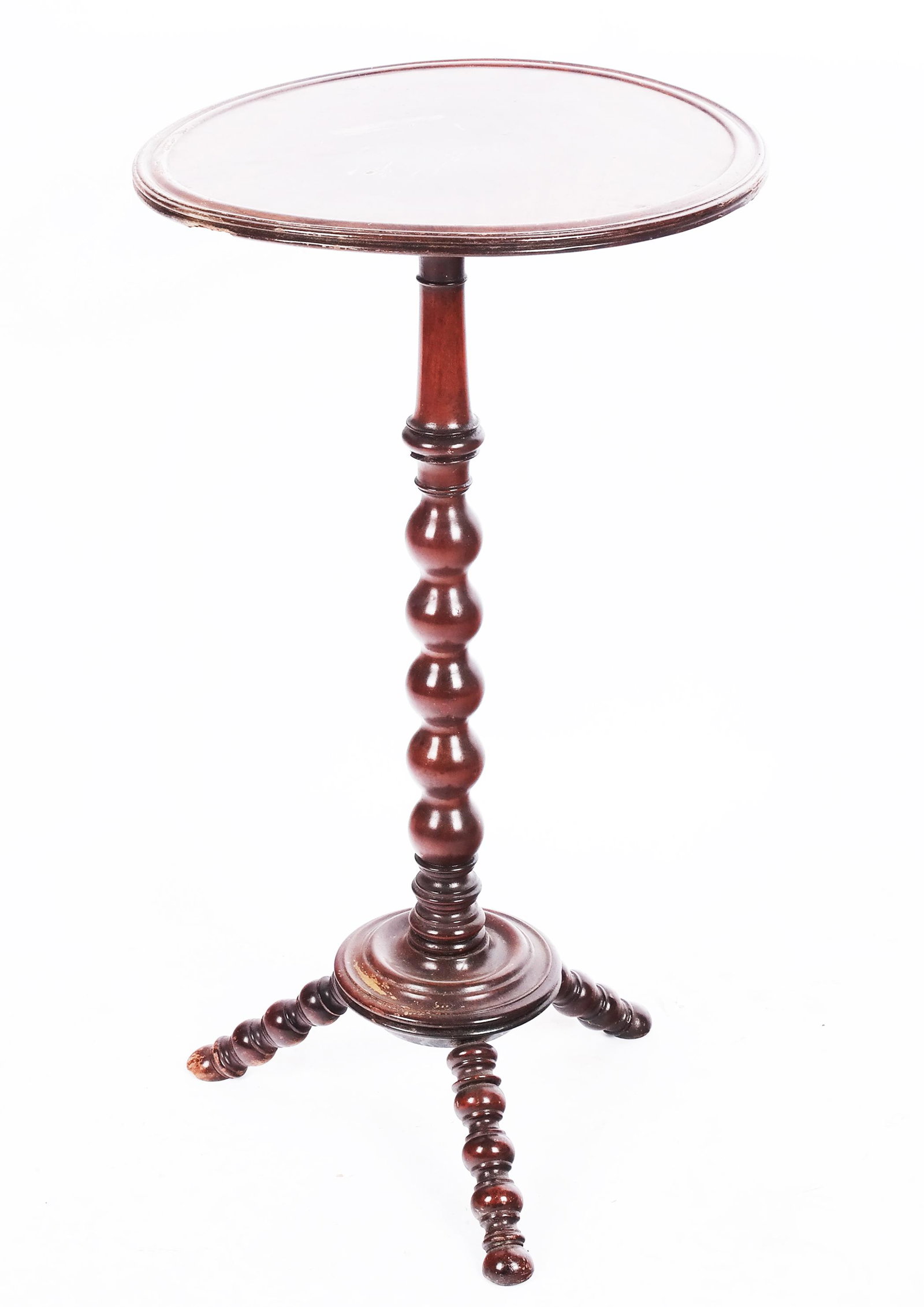 Late 19th C. English Bobbin Turned Candlestick: Late 19th century English bobbin turned candlestick, the round tray top on bobbin turned post and three mahogany legs. [29 1/2" H x 16" Diam.].