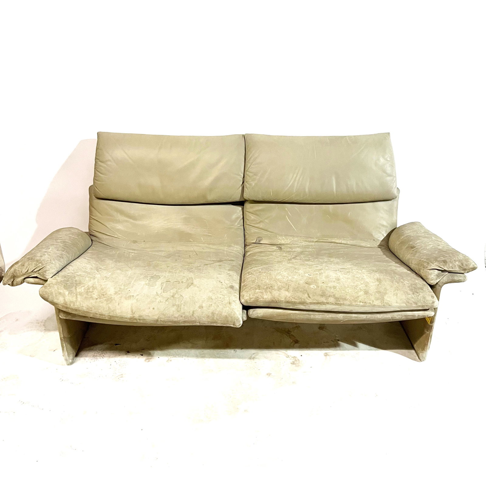 Contemporary-Style 2-Seat Leather Settee: Leather two-seat settee with detachable Velcro fasteners. [33 H x 73 W x 29 D inches].