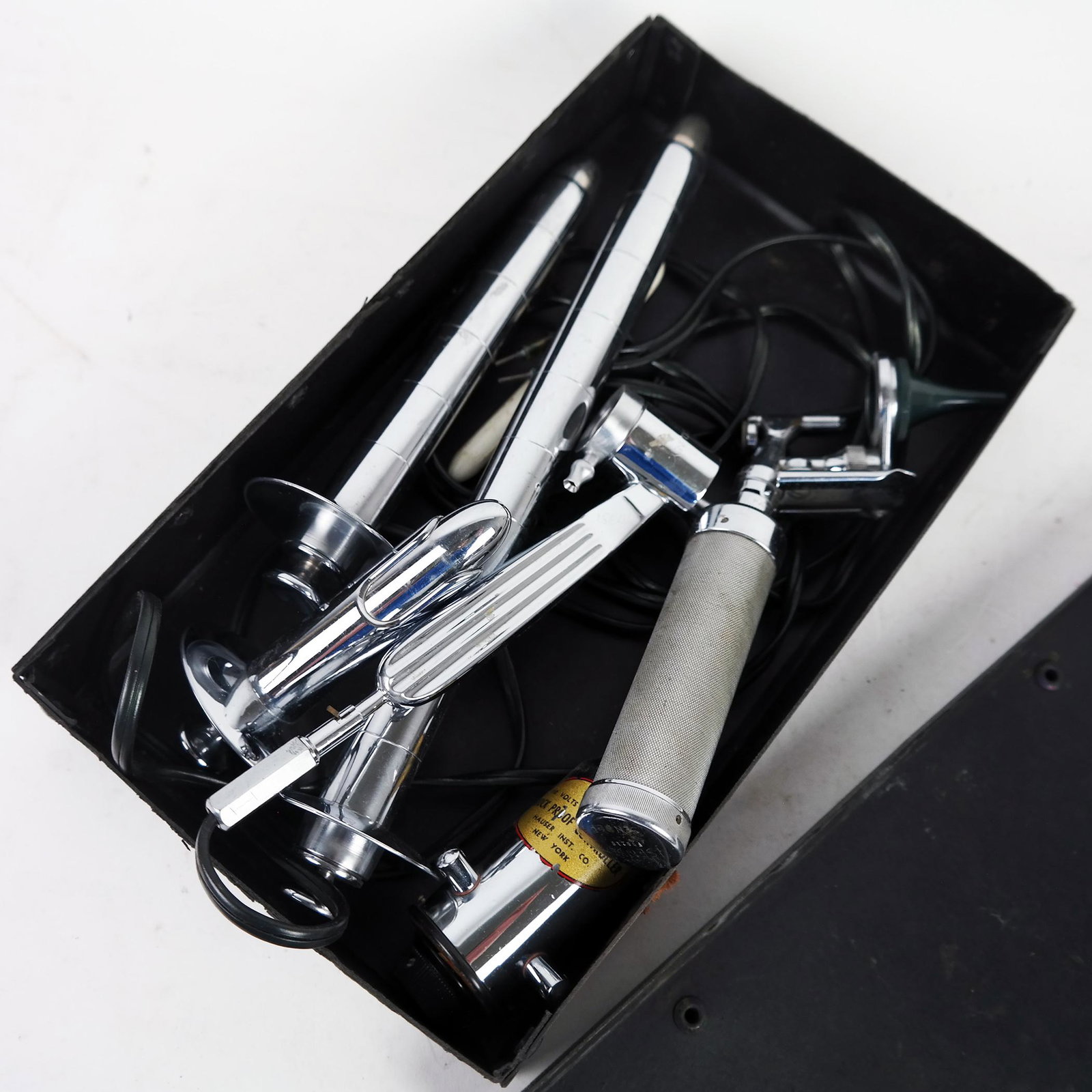 Vintage Steel Proctology Instruments: Vintage steel proctology instruments with several implements for rectal examination. [Case: 2 1/2" H x 7" W x 12" D]. Signs of light use and wear.