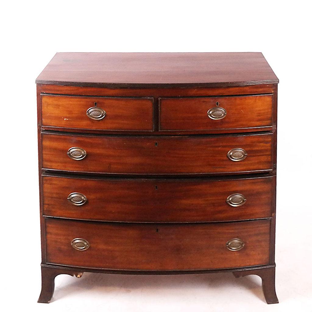 Mahogany Bow Front Chest of Drawers: 19th century mahogany bow front chest of drawers with two short over three long drawers, raised on ogee bracket feet. [42 1/4" H x 43 1/2" W x 21 3/4" D]. Stains and marks to top; scuffs and wear to c
