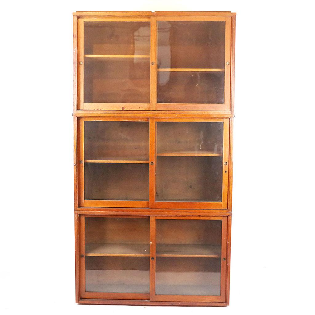3-Part Oak Cabinet: 3-part oak cabinet with sliding glass doors and shelves. [81" H x 43" W x 13" D]. One sliding door cracked; cabinet a little wobbly.