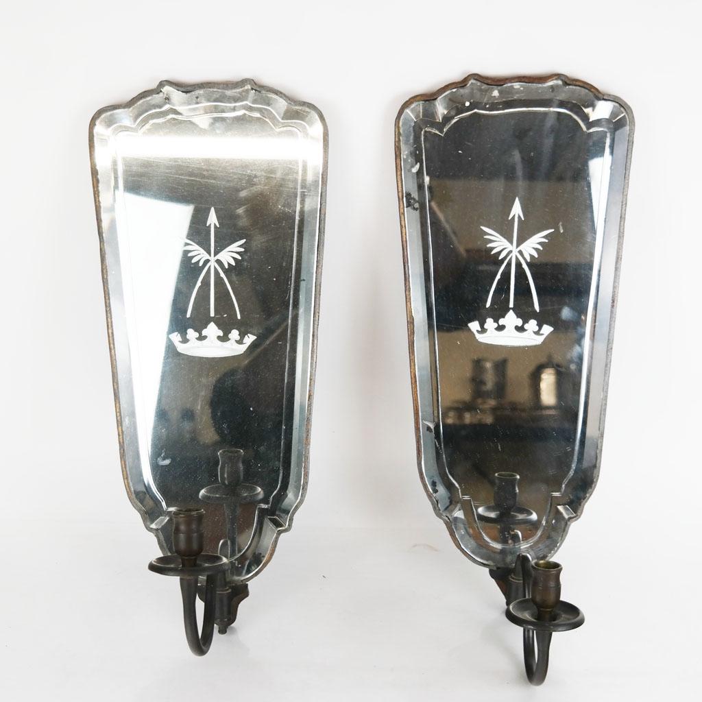 Pair of Mirrored Glass & Bronze Sconces: Attractive pair of mirrored, engraved beveled glass and bronze sconces, of shield shape, with bronze armature to hold a single candle, engraved with English heraldic motifs, the glass carefully worked