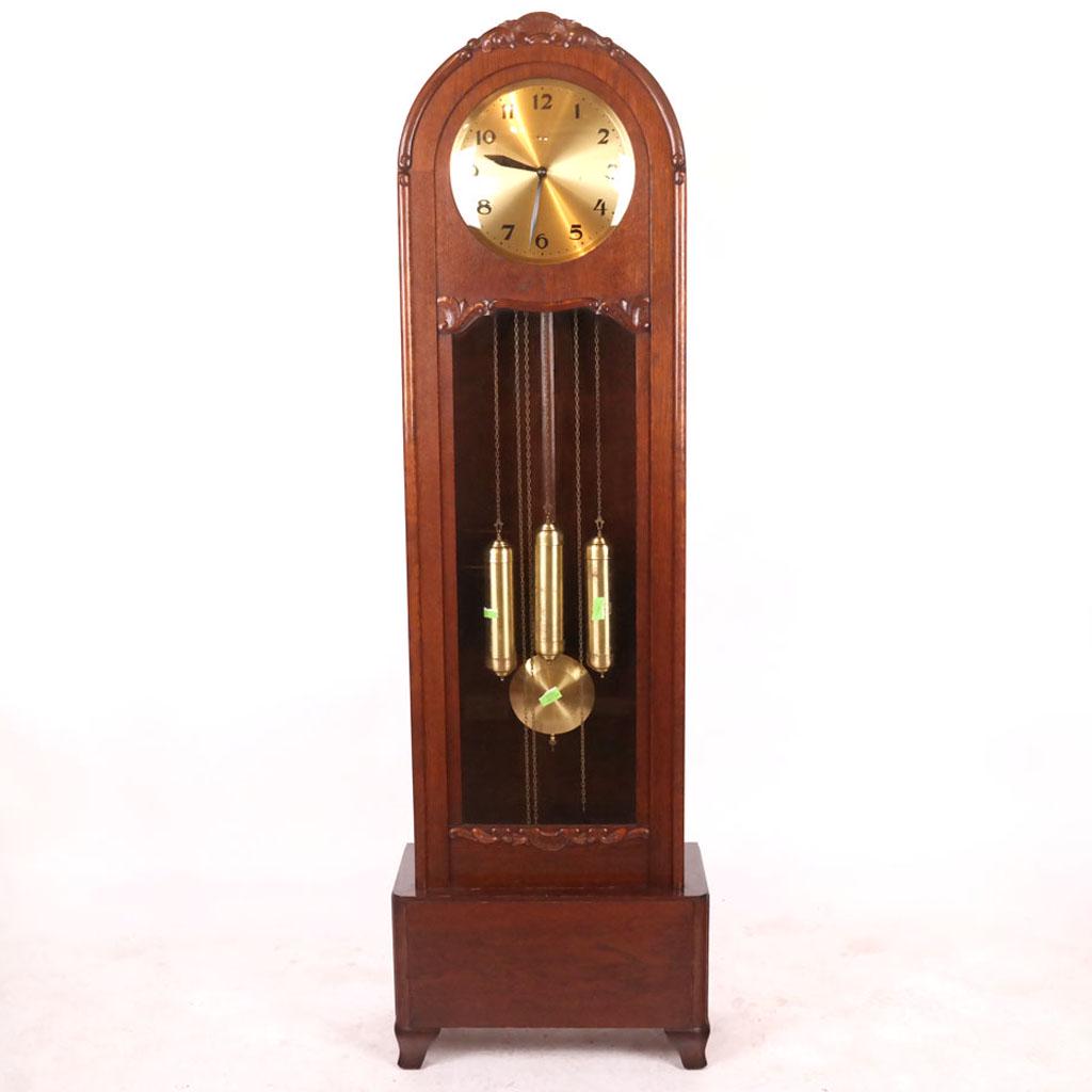 Mauthe, Germany Oak Grandfather Clock: 20th century Mauthe, Germany grandfather clock, including 3 weights and pendulum. [77 1/2" H x 20" W x 11" D].