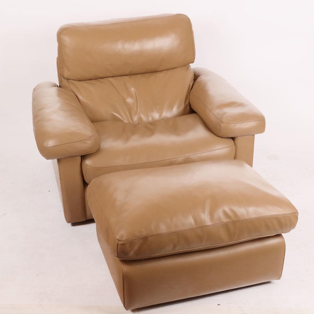 Poltrona Frau Club Chair & Ottoman: Modern tan leather lounge / club chair and a matching ottoman by Poltrona Frau, Italy. [Ottoman: 15" H x 26" W x 21" D; Chair: 28" H x 46" W x 36" D; 14" H to seat].