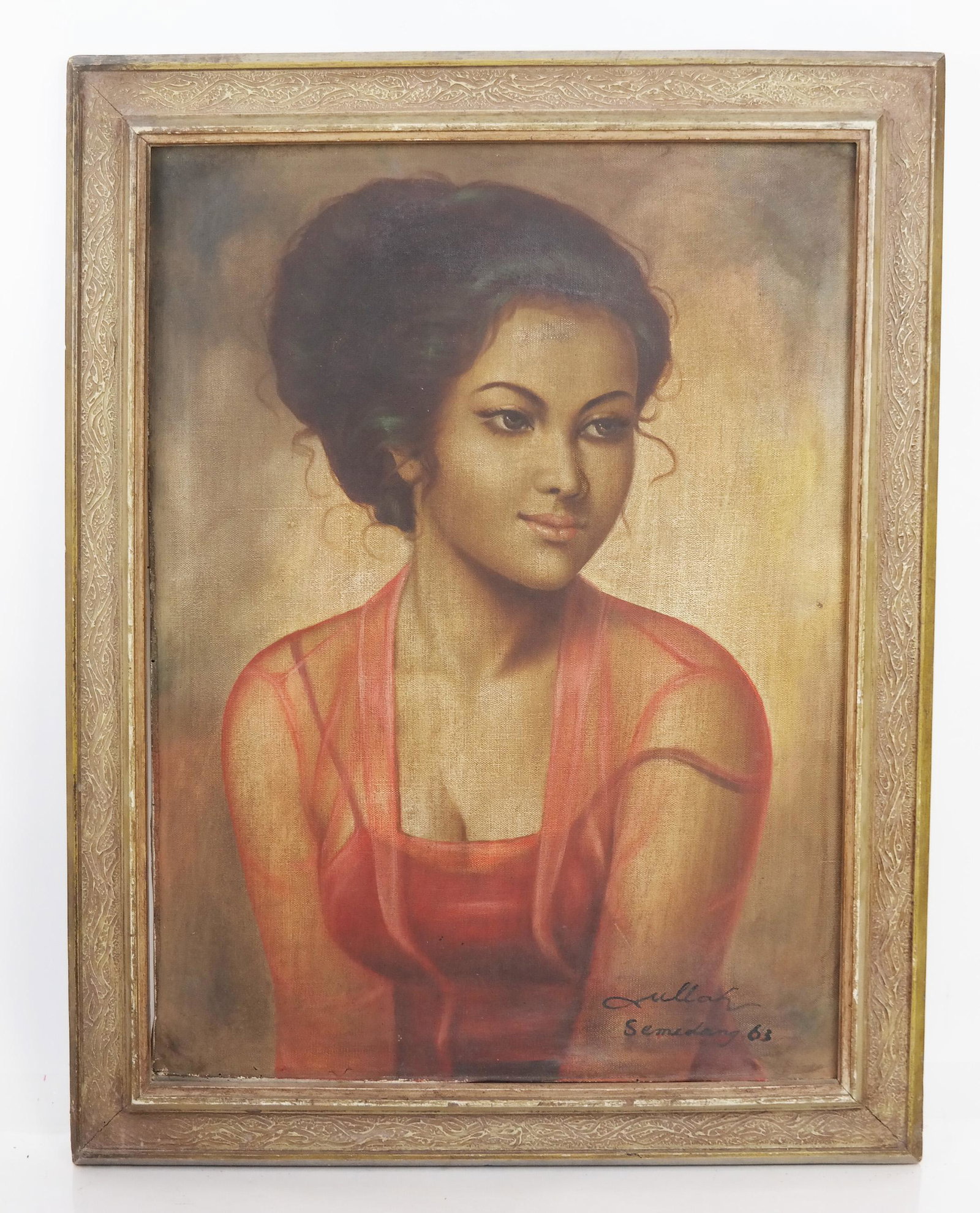 Portrait of a Girl, Signed and Titled: Signed and titled portrait of a girl. Probably of Indonesian orgin. Signed to front "Ullah Semidang '63"; to rear "Modjang Periangan - Ullah." [Image: 23.5 x 17.5 inches; Frame: 28 x 21.5 inches]. Bot