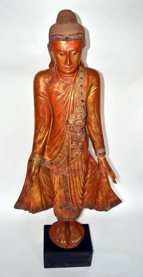 Southeast Asian Buddha: Wood figure, Southeast Asian Buddha, draped in robes with jewels. Figure: 60" H x 28.25" L, Base: 10" x 14" x 7.5".