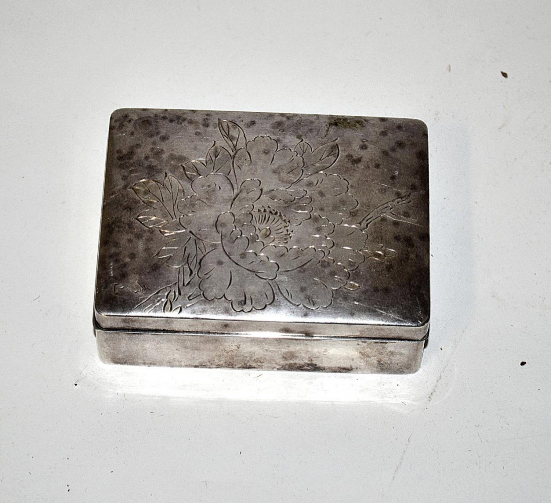 Japanese Sterling Silver Box: Bears wood liner and features an engraved top depicting a peony blossom [bears a calligraphy signature at bottom right]. 1 3/8" H x 3 7/8" W x 3" D.