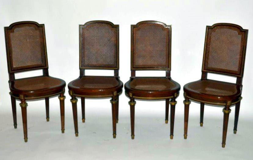 Four Francois Linke Side Chairs: Set of four 19th century French side chairs. Each feature caned seats and backs with dore bronze trim. One seat needs re-caning, otherwise in good condition. 16" x 23.5" x 28.25" H.