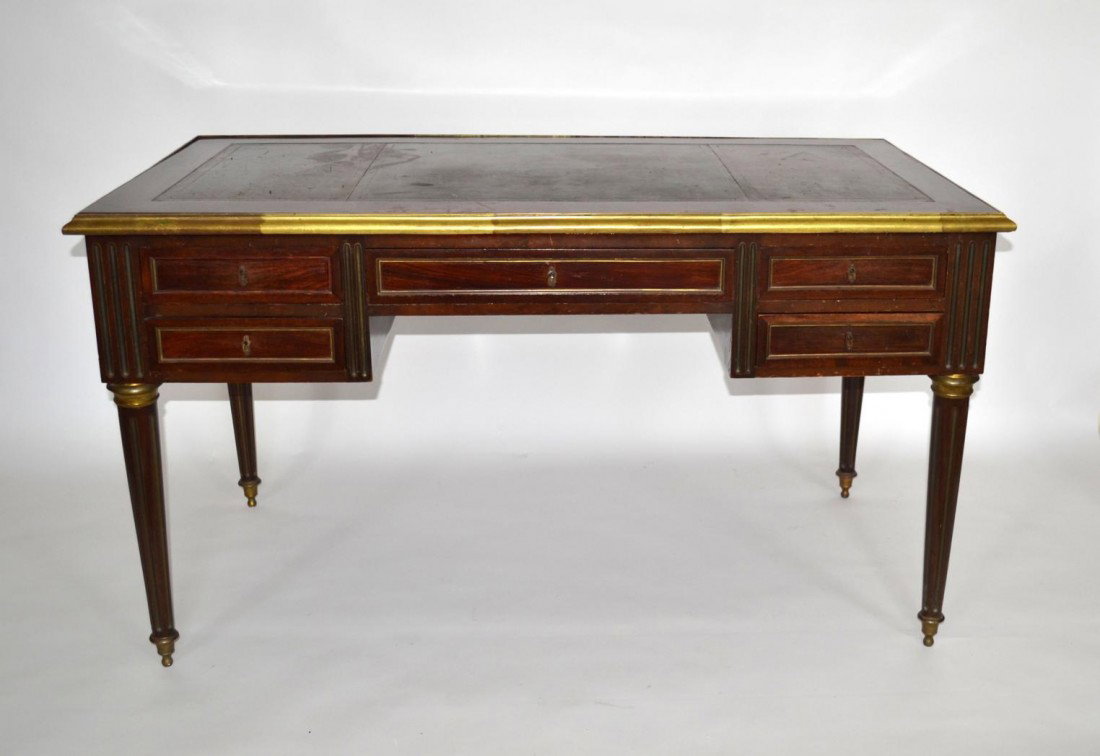 Empire Desk: Empire partners desk. Double-sided with five functional drawers on one side, and five faux drawers on the other. Bears a green tooled leather top. 55" x 29.5" x 30.5" H.