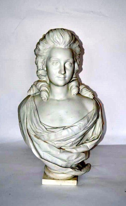 Parian Bust of a Woman: A classical bust of a woman in draped gown. Good condition. 25.5" H x 15" L.