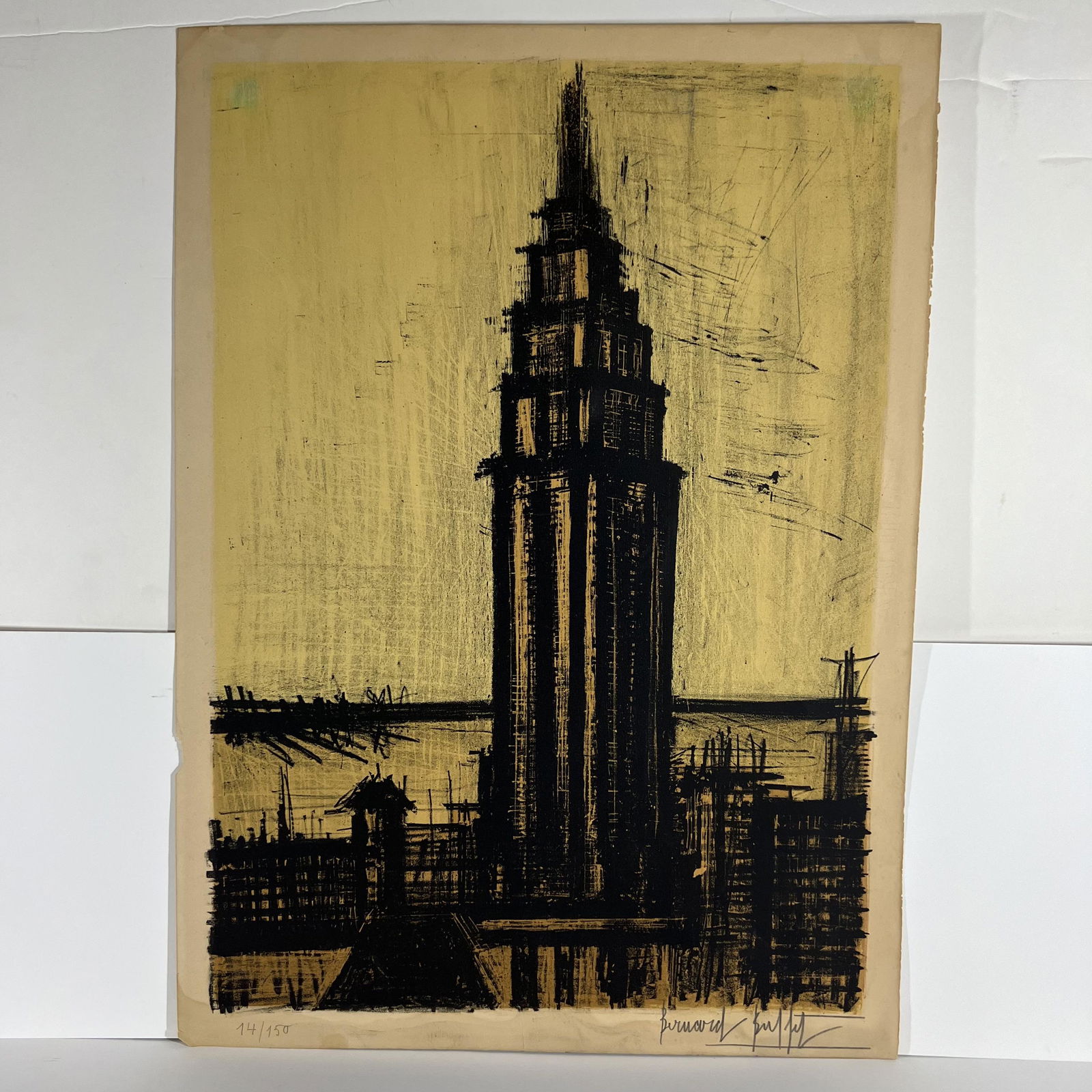 Bernard BUFFET: "New York IV" - Drypoint: Bernard Buffet (French, 1928-1999) drypoint of a skyscraper, titled "New York IV," signed in pencil lower right and numbered "14/150," unframed. Provenance: Phyllis Lucas Gallery, NYC. [Sheet: 29" H x