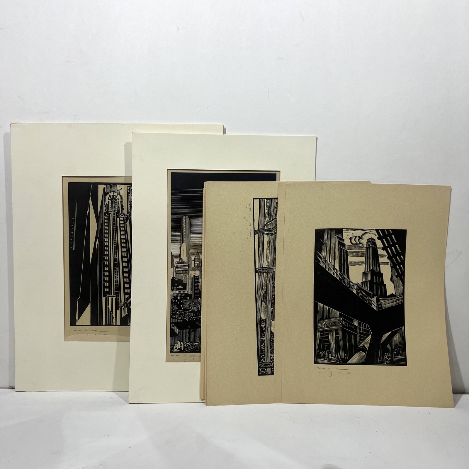 Earl M. WASHINGTON: Nine Urban Woodcuts: Earl Marshawn Washington (American, b. 1962) nine urban woodcuts of city architecturals and industrial, signed, circa 1930's. Provenance: Phyllis Lucas Gallery, NYC. [9" H x 15" W]. In good condition 