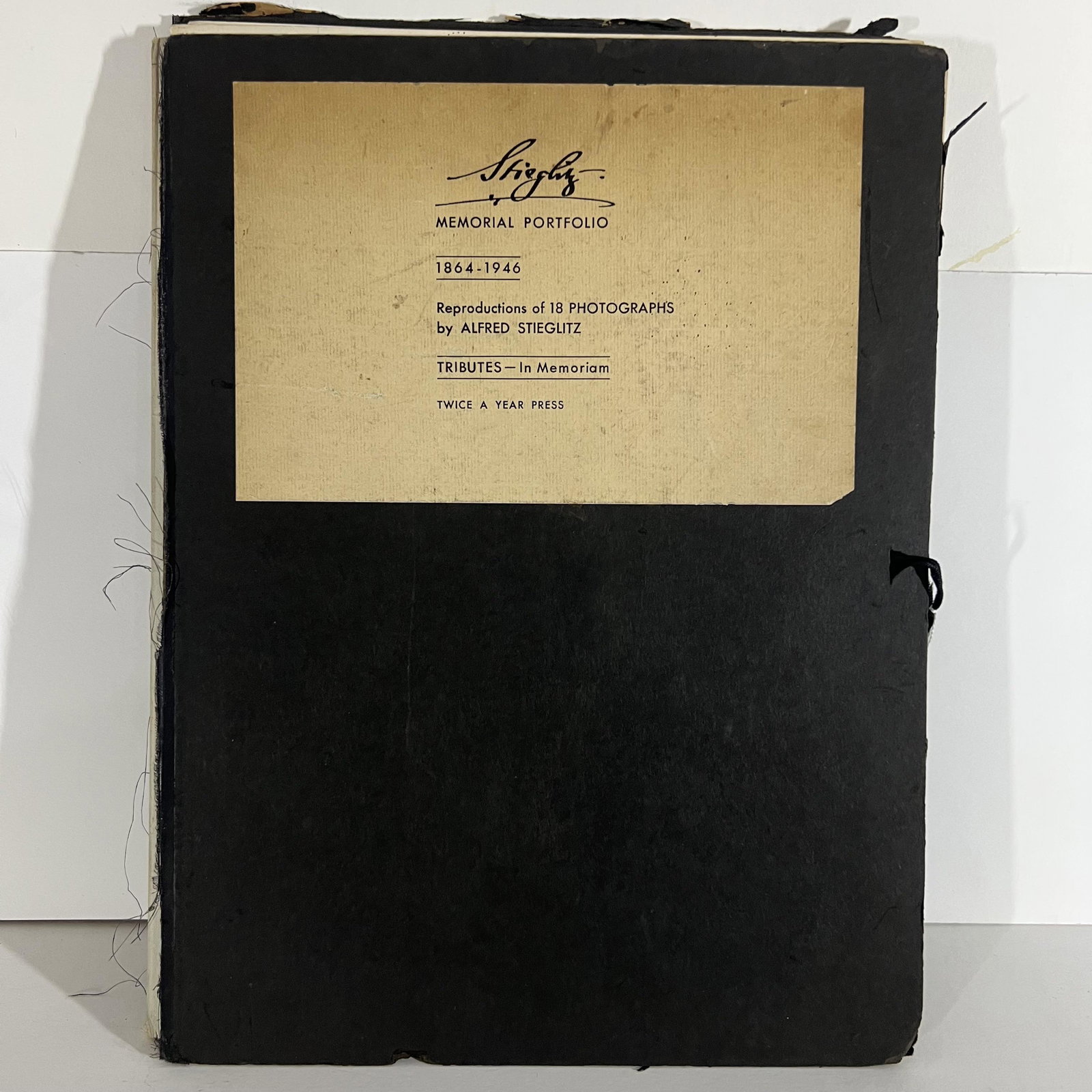 "Stieglitz Memorial Portfolio..." - Repro. Photos: "Stieglitz Memorial Portfolio 1864-1946: 18 Reproductions of Photographs by Alfred Stieglitz," Twice a Year Press, NYC, 1947. Small folio, 63 pages of text, 17 loose (as issued) photographs (one missi