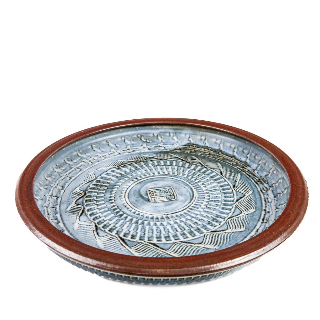 Large Mid-Century Modern Shallow Bowl: Large mid-century modern blue glaze shallow bowl with brown rim, signed "Paul" and stamped in center, Asian inscription. [2 1/4" H x 15 1/4" Diam.]. Provenance: From the Eileen and Marvin Reingold Col