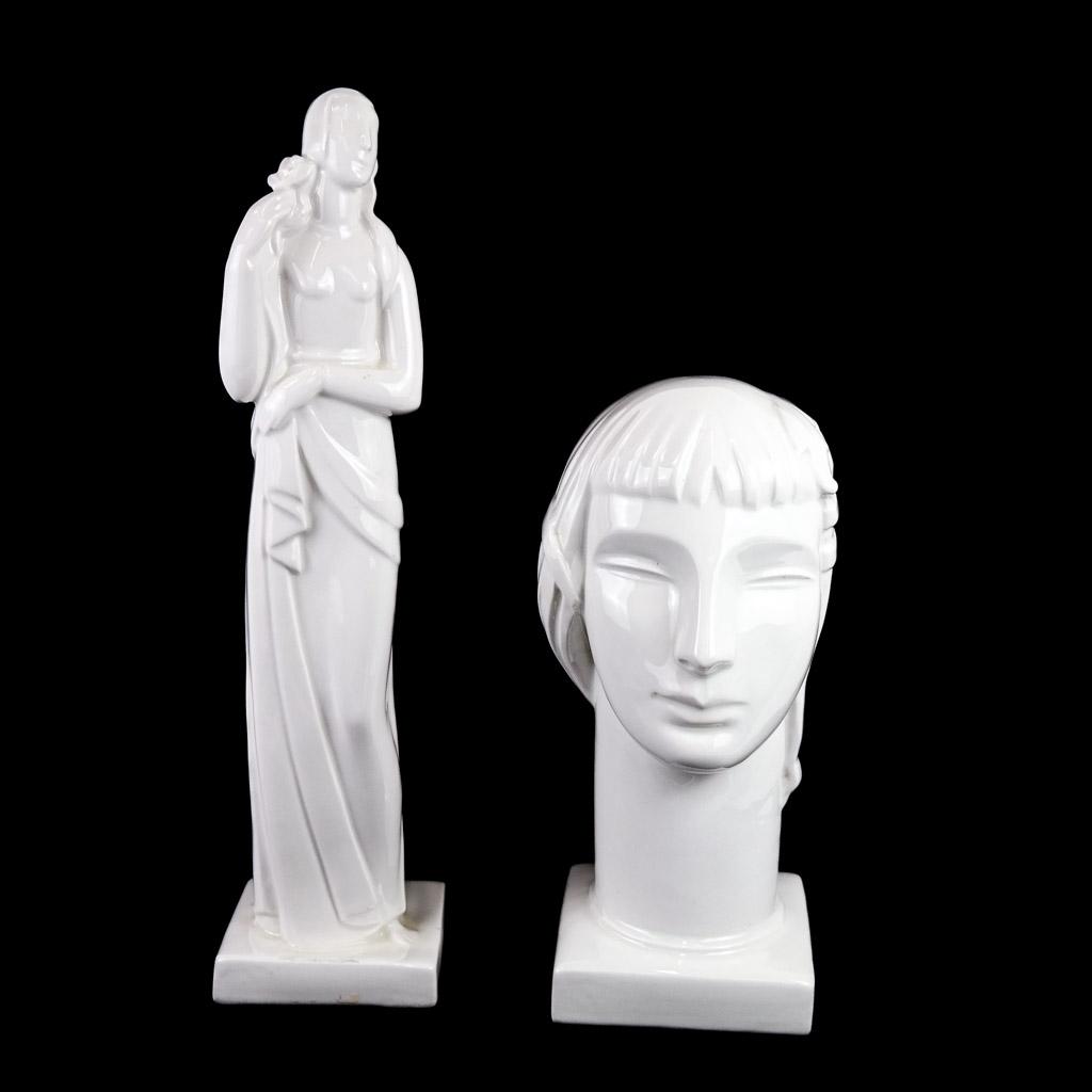 Two Lamberton Scammell Porcelain Pieces: Two Lamberton Scammell porcelain pieces by Geza DeVegh, including a two sided head of Adam and Eve and a tall art deco woman, circa 1924-1954. [Tall woman: 17" H x 4" sq.]. Provenance: From the Eileen