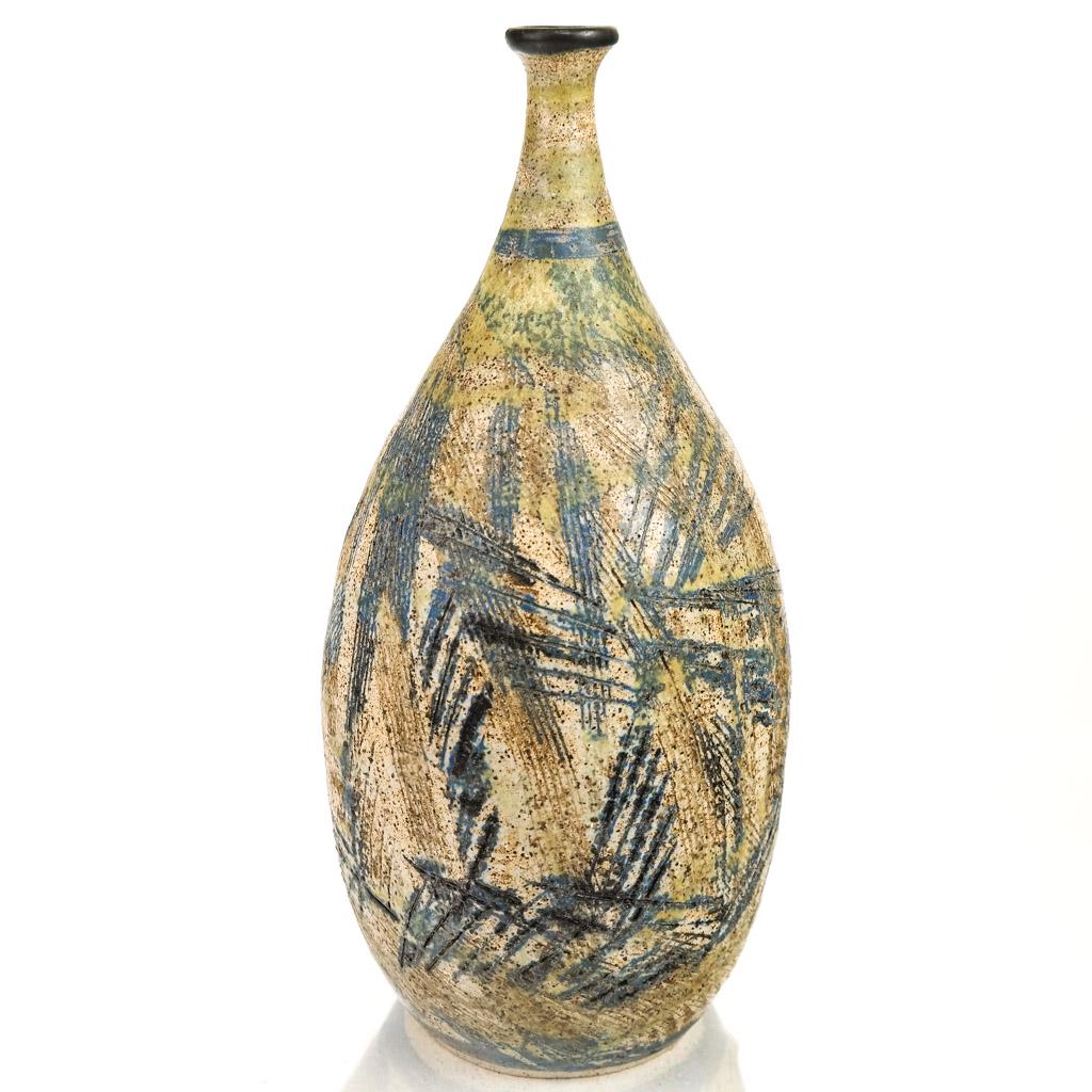 Helen Noel SHAGAM: Tall Vase: Thin neck light glaze tall vase with incised design and dark blue rim, by Helen Noel Shagam (1912-1989). [13 1/2" H x 6 1/2" Diam.]. Provenance: From the Eileen and Marvin Reingold Collection.