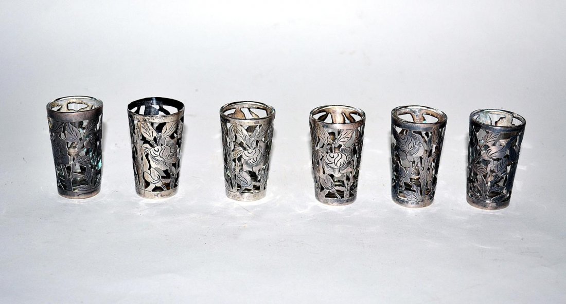 Set of 6 Silver Overlay Shot Glasses: Mexican silver overlay with leafy cabbage rose motif. One missing liner, otherwise in good condition. [.49 OZT]