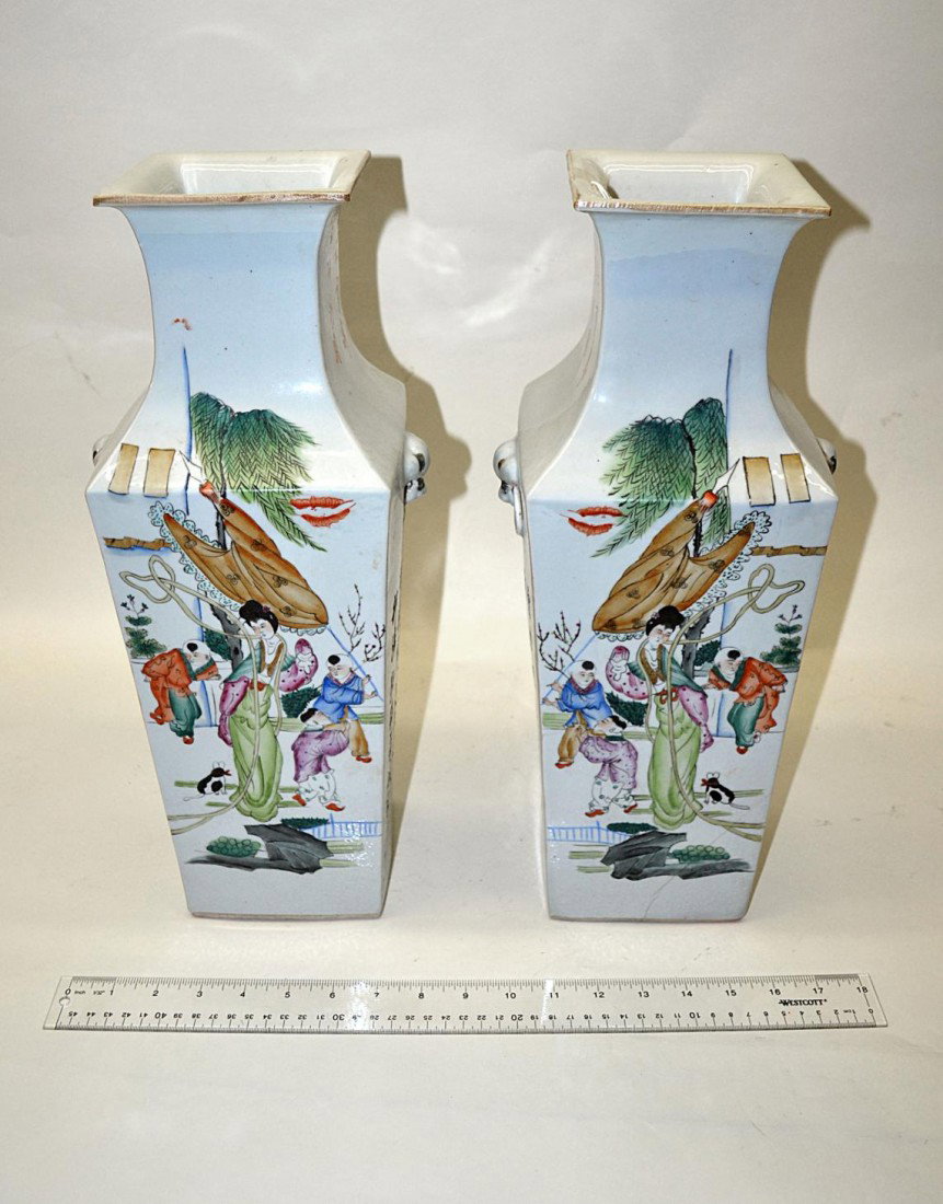 Pair of Chinese Vases: Pair of decorated vases, white ground having figures and writing all around. Good condition. 17" H.