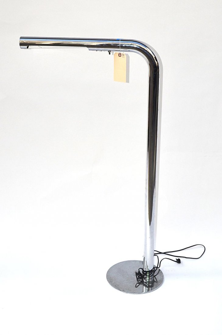 Sonneman Chrome Floor Lamp: Modern floor lamp composed of a continuous chromed steel tube with down light on a circular base. In good condition. 11" Dia (base) x 45" H x 25" D.