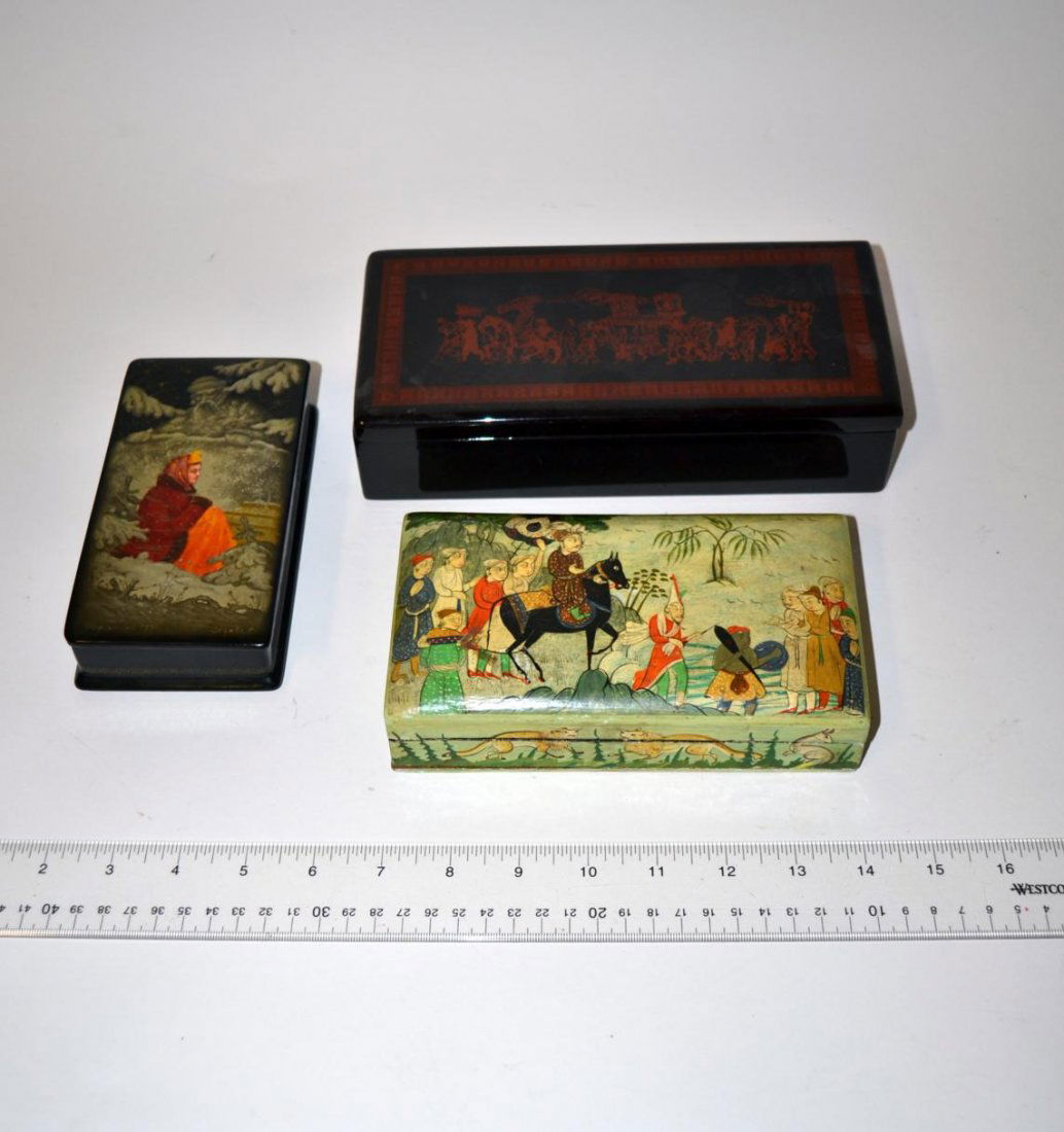 3 Decorative Boxes: Comprises a painted box w/Far Eastern sultan on horseback, an Eastern European lacquered box w/woman & Father Winter and a Chinese lacquered box w/procession scene. Largest 9" x 4 1/4" x 2 1/8". All c