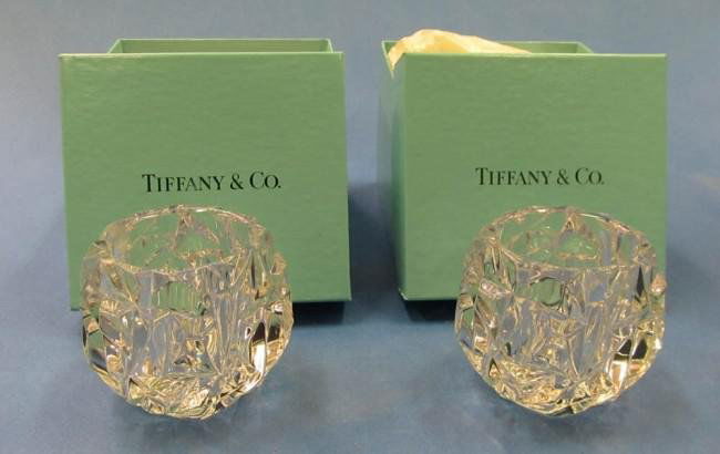 Pair of Tiffany & Co. Crystal Candle Holders: Each bear abstract angular surface texture and deep well for tea candle. Both in excellent condition with original boxes. 2 1/4" H x 3 1/4" Dia.