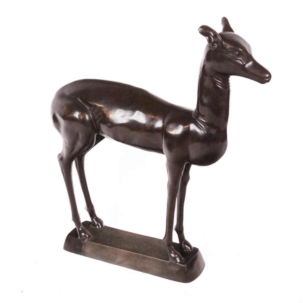 Bronze Reproduction Model of Deer: Bronze copy of the original French model of a young deer, in dark brown patina, not marked. [33" H x 31" W x 8" D]. In good condition.