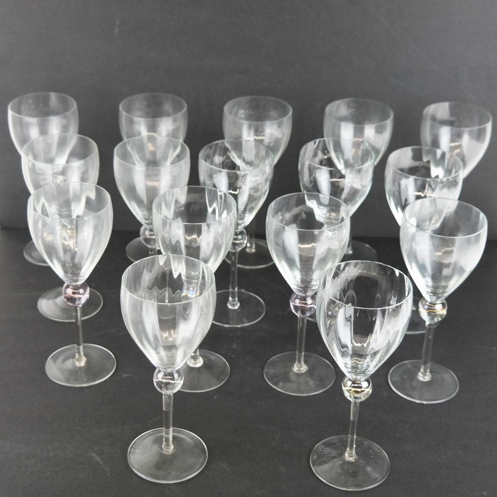 Art Deco-Style Clear Glass Goblets (16): Sixteen Art Deco-style clear glass goblets, of elegant outline, with ribbed details over tinted balls on slender stems, unmarked. [8 3/8" H x 3 1/2" Diam.]. In overall good condition.