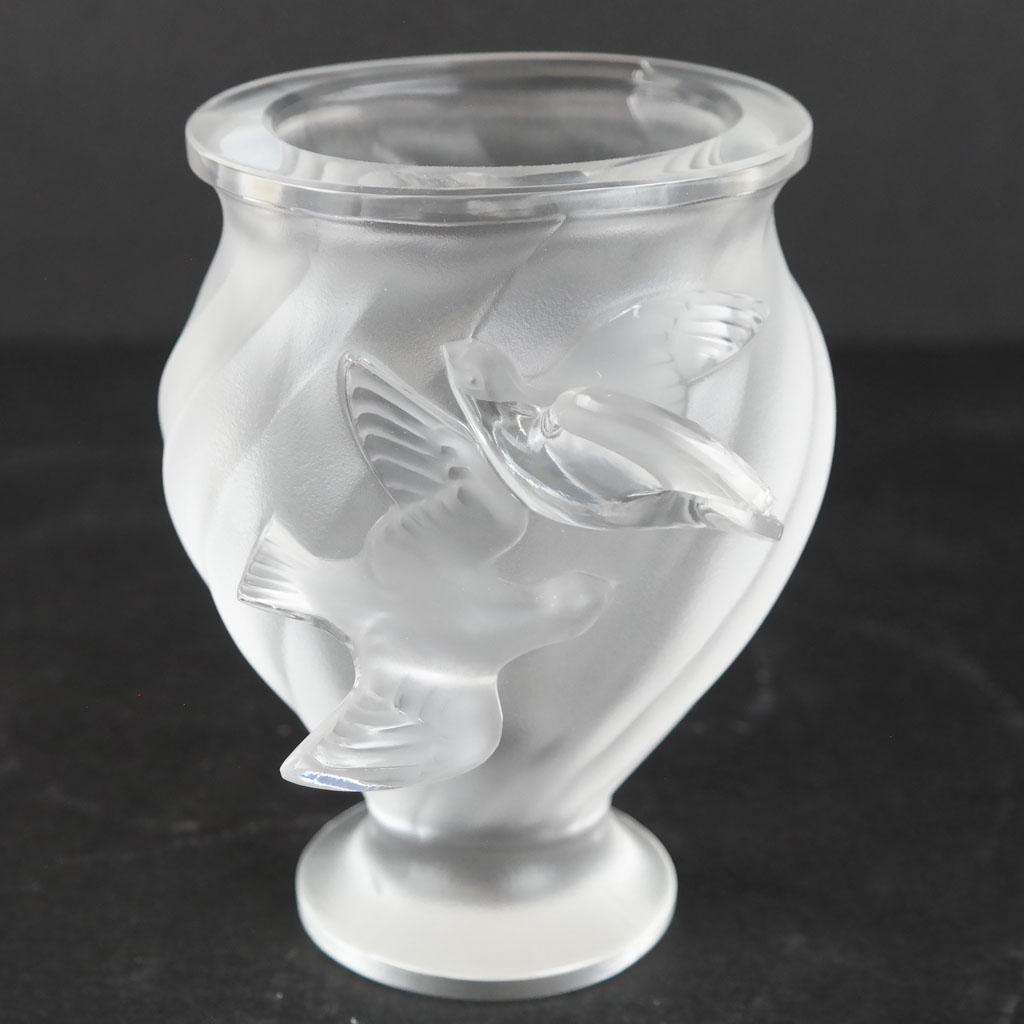 Lalique French Frosted Crystal "Rosine" Vase: Lalique French frosted crystal "Rosine" vase, with relief detail of dove motifs, bearing etched signature to base. [5" H x 4 1/4" Diam.]. In overall good condition.