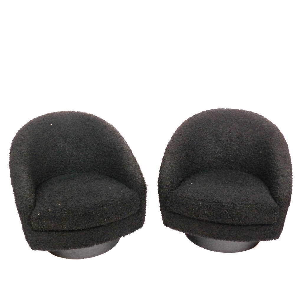 Mid-Century Modern Barrel Tub Chairs: Mid-century modern barrel tub chairs in the manner of Vladimir Kagen, with black curly fur upholstery, having rocking and swivel action. [30" H x 31" W x 32" D]. Wear and areas of crushing; marks to b