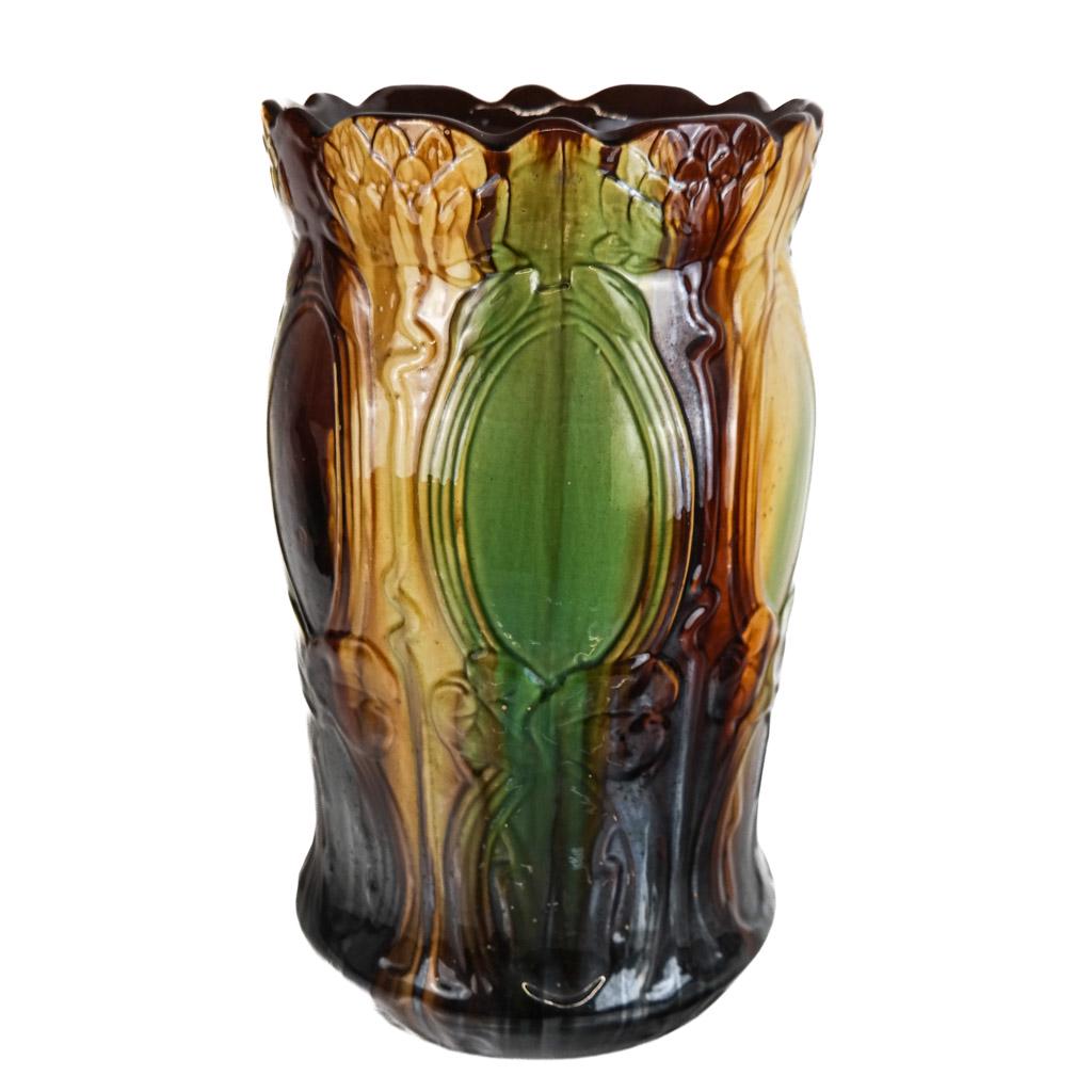 Majolica Pottery Floor Vase / Umbrella Stand: Stylized floral design floor vase or umbrella stand, in "egg and spinach" colors, with earth tones, probably European. Not marked. [18" H x 10 1/4" Diam.]. In good condition.