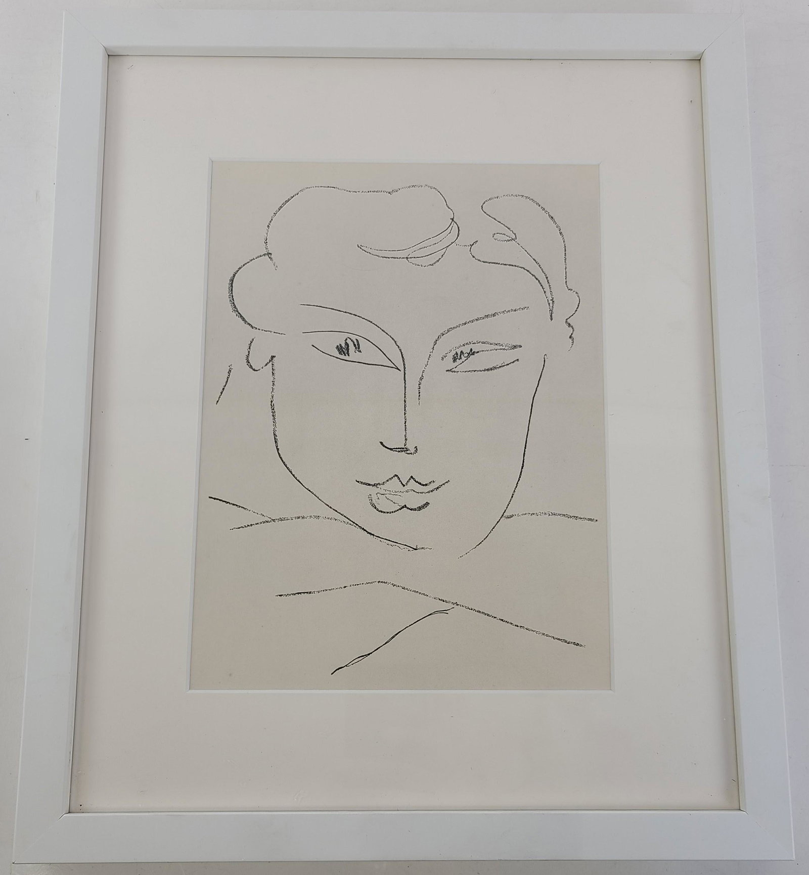 Style of MATISSE: Portrait - Line Drawing: An unsigned portrait in line drawing, framed under glass, in the style of Matisse. Provenance: Phyllis Lucas Gallery, NYC. [Art: 9" H x 7" W; Frame: 15.5" H x 12.5" W]. In good condition.