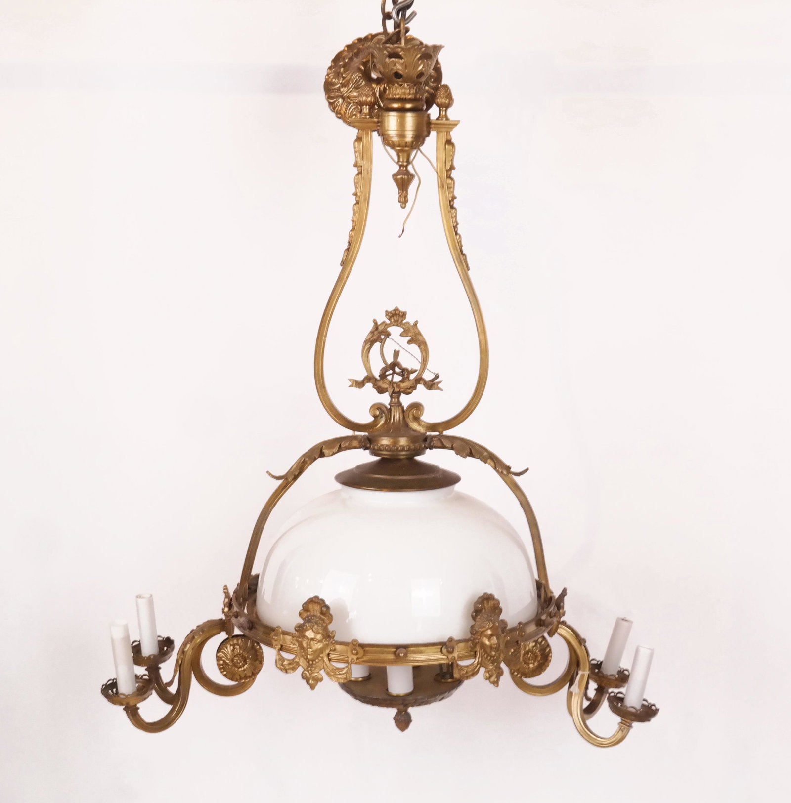 French Bronze & Glass Dome Chandelier: French bronze and glass dome chandelier, having female face appliques and four chandelier lights. [35" H x 27" L x 15" Diam. (rim)].