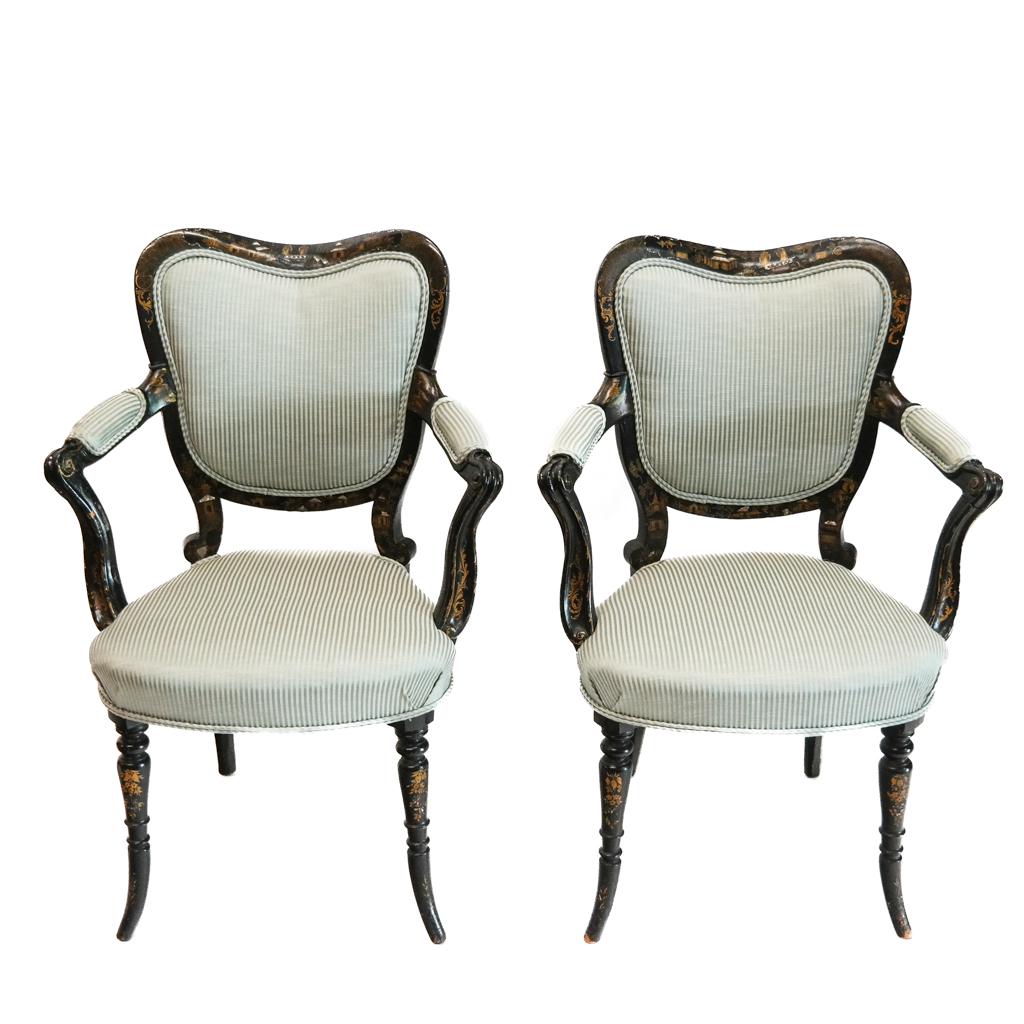 Pair of Victorian Ebonized Armchairs: Pair of 19th century ebonized papier mache armchairs with shell and gilt accented decoration of pagodas, with figures and scrolling motifs. [37" H x 25" W x 19 1/2" D]. Losses to decoration; marks and