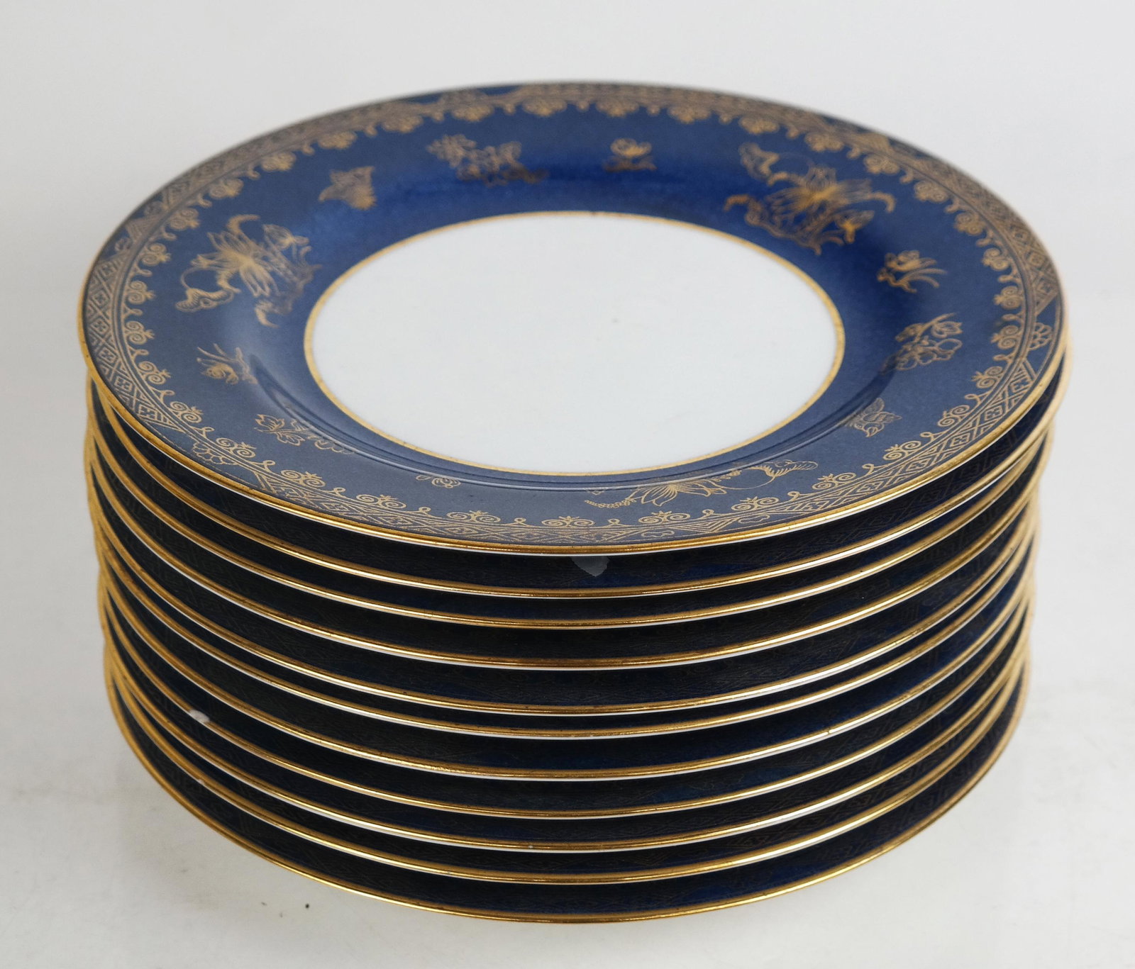 Spode Copeland Porcelain Luncheon Plates: Spode Copeland English porcelain luncheon plates, circa 1900, with gilt accented speckled borders, marked to base, retailed by Gilman Collamore & Co., New York, Fifth Avenue. [9" Diam.]. Chip to edges