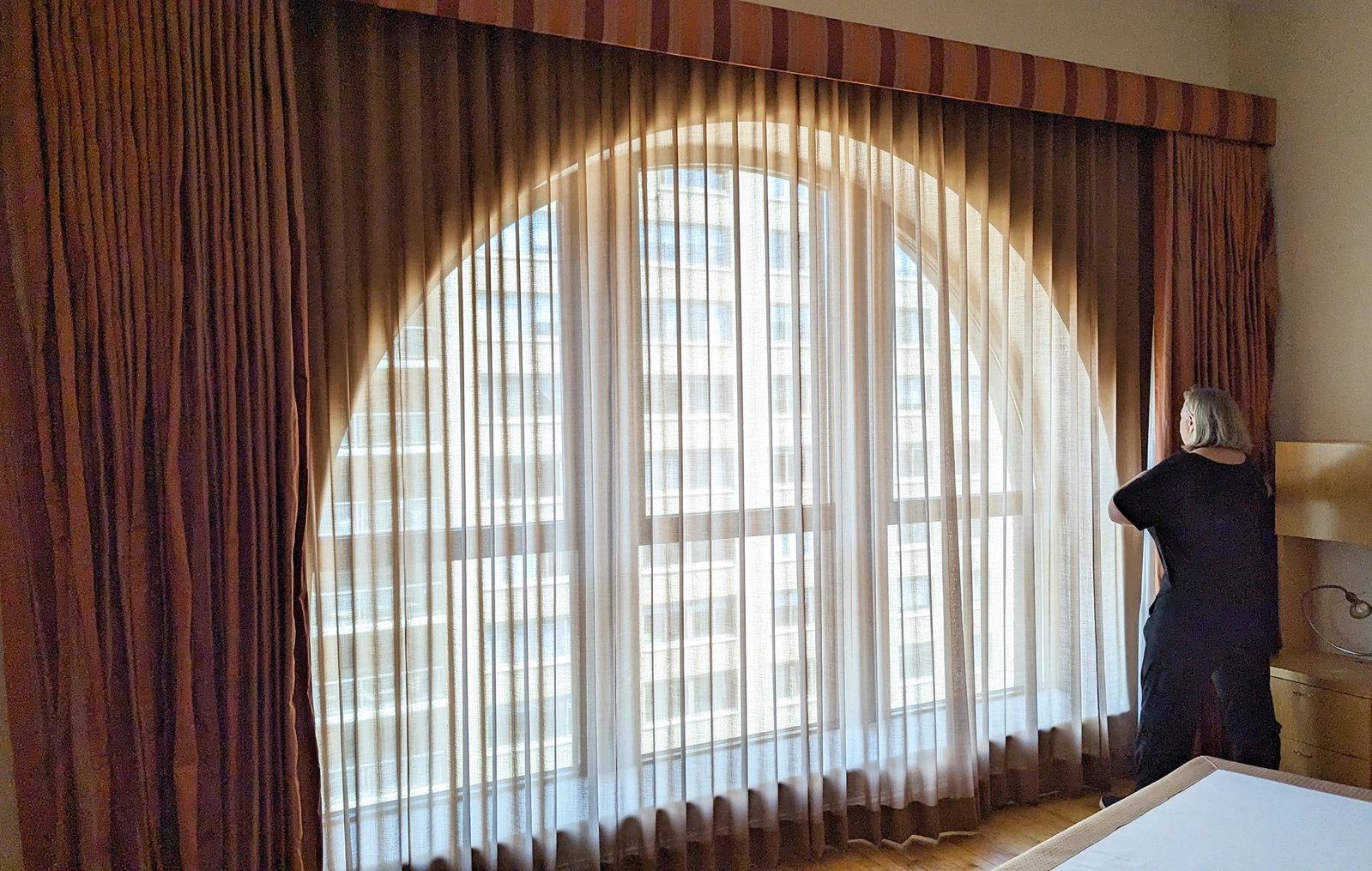 Satin Curtains With Valance: Persimmon-burnt orange colored satin curtains with valance. [9 H x 13 W feet ].