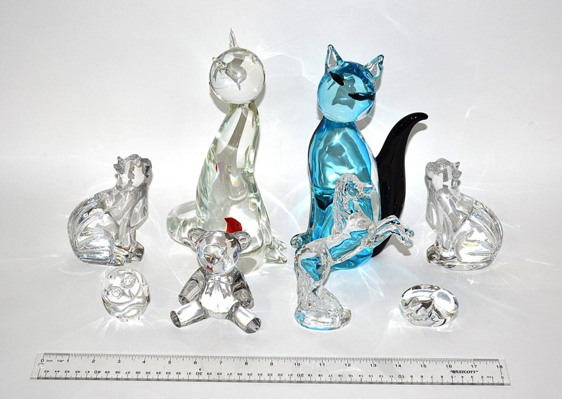 International Glass Menagerie with Paperweights: Comprises two Murano glass cats (one with chipped ear), a Ralph Lauren Teddy bear, a pair of Waterford cats, a Waterford stallion, and a Steuben cat and owl. All in very good condition. Tallest: 10 1/
