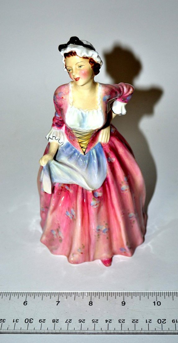 Royal Doulton "Mary Jane" Figure: Porcelain figure of an 18th C. maiden. Stamped on bottom "HN 1990." In very good condition. 7 5/8" H.