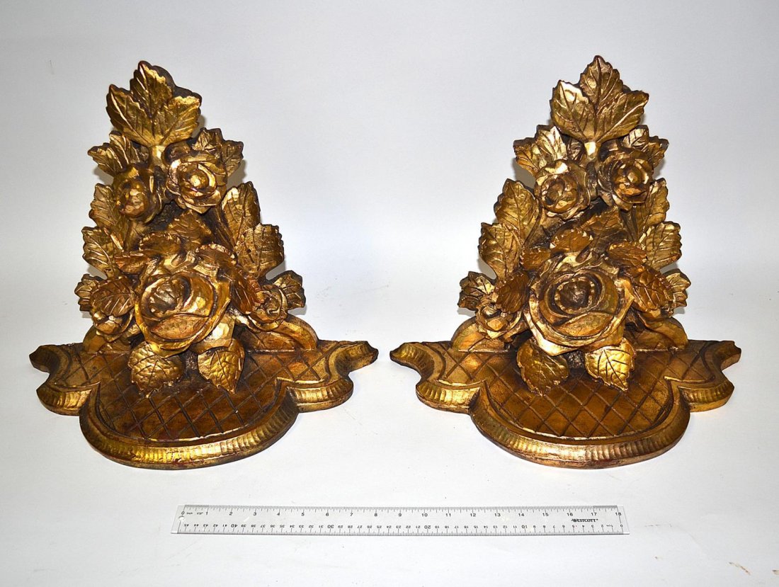 Pair of Faux Carved Gilt Wood Brackets: Each composed of faux-finish fiberglass with cabbage rose motif. 17 3/4" W x 8" D x 15 3/4" H. Both complete and in good condition.