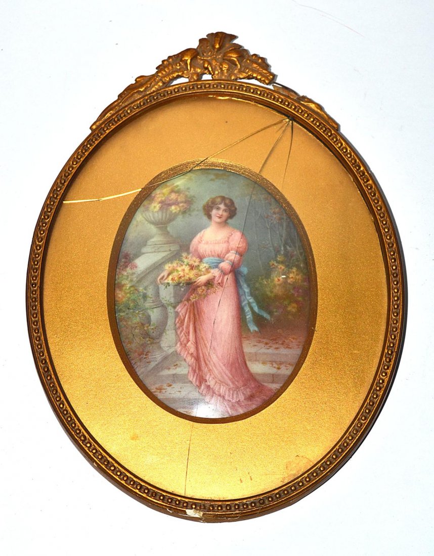 Oval Porcelain Plaque: Depicts a neo-classical woman in pink gown beside a garden. Plaque in good condition, signed lower left. "Leslie Johnson". Plaque: 4 1/4" x 6", Frame: 8 1/2" x 12". Glass needs to be repaired.
