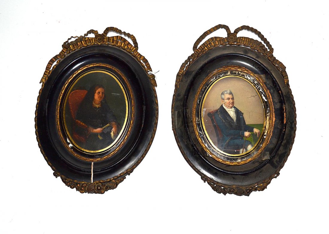 Pair of Spanish Colonial Portraits on Tin: Pair of oval portraits depicting man and woman with eglomise borders. In good antique condition. Frames need restoration. Art: approx 5" x 4", Frames: 10" x 7".