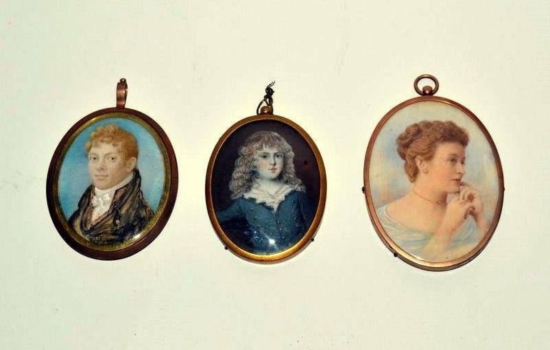 Three Miniature Portraits: Each in oval brass frames, two of men, one of a woman.